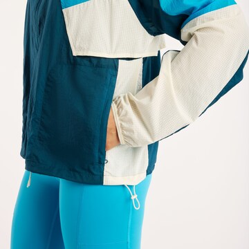 new balance - Chaqueta deportiva en azul