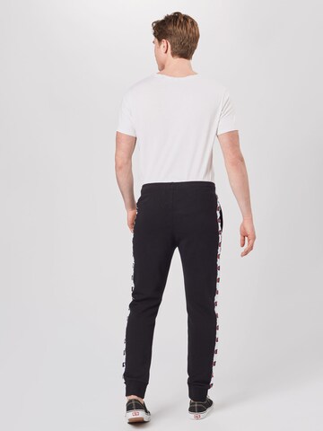 Champion Authentic Athletic Apparel - Tapered Pantalón 'Rib Cuff' en negro