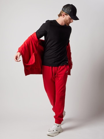 Regular Pantalon 'Joggers Felpati' OWN Off With Nature en rouge