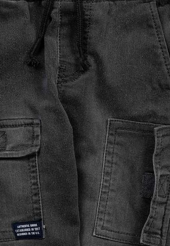 MINOTI Tapered Jeans in Schwarz