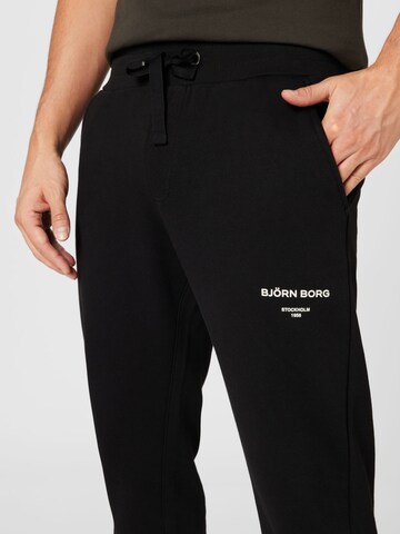 BJÖRN BORG - Tapered Calças de desporto em preto