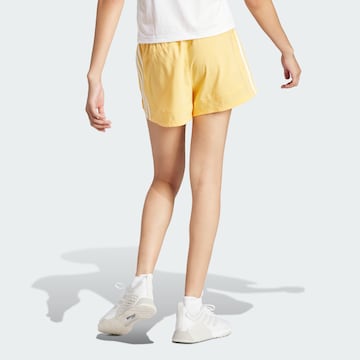 ADIDAS PERFORMANCE Loose fit Workout Pants 'Pacer' in Yellow
