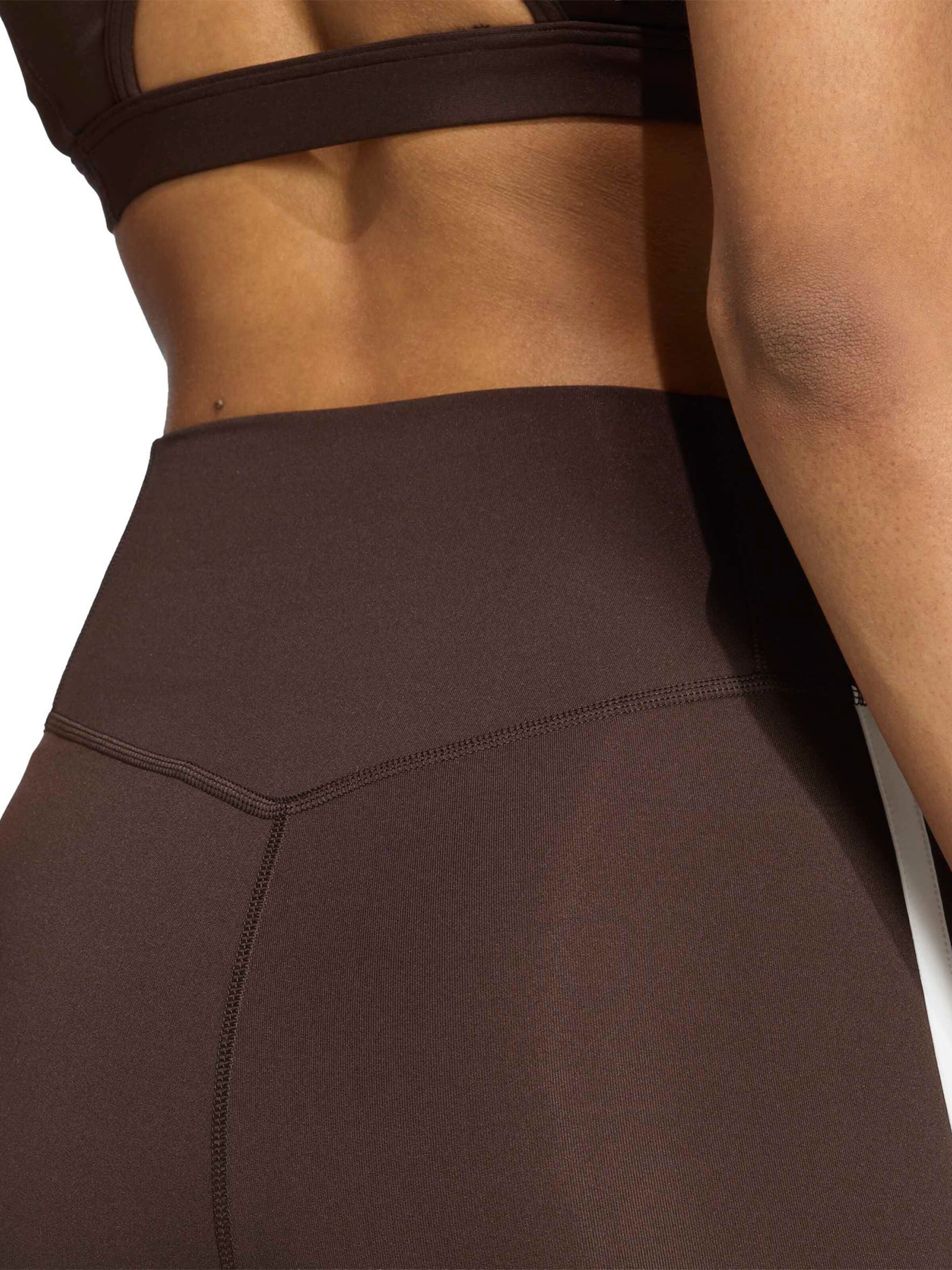 Flared Pantaloni sportivi 'Opt Ess' di ADIDAS PERFORMANCE in marrone