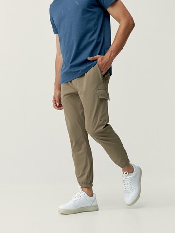 Born Living Yoga Tapered Weatherproof pants 'Minho' in Brown