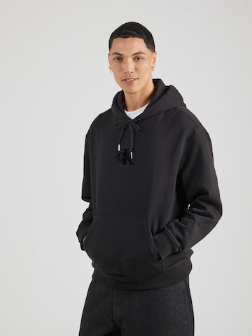 Sweat-shirt Calvin Klein Jeans en noir : devant