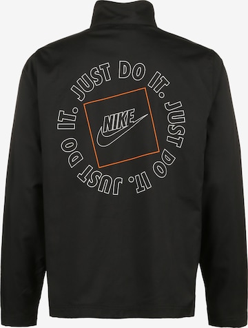 Nike Sportswear Sportjas 'Just Do It' in Zwart