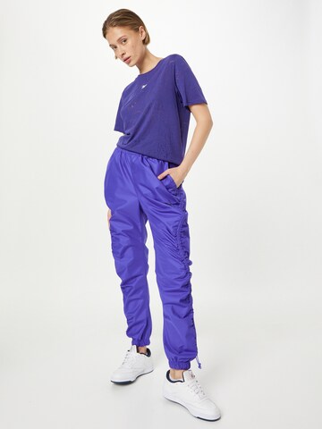 Reebok - Camiseta funcional en lila