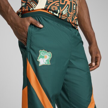 PUMA Regular Sports trousers in Green