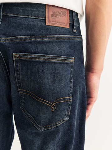 Coupe slim Jean 'Motion Flex' Next en bleu