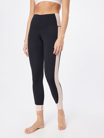 NIKE Skinny Workout Pants in Black: front