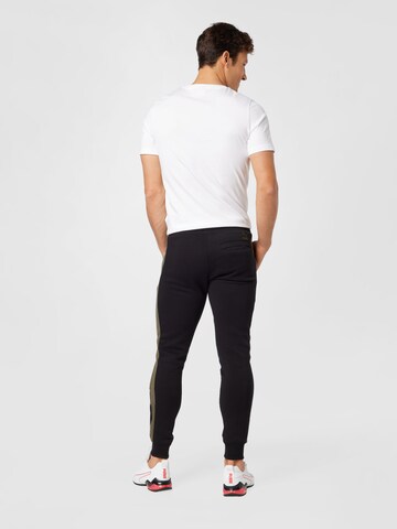 PUMA Tapered Hose 'Team T7' in Schwarz