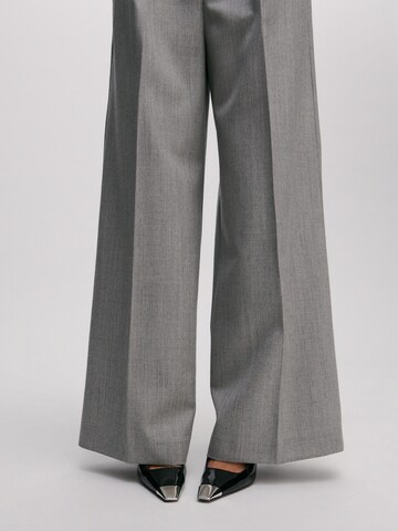 ABOUT YOU x Marie von Behrens Wide leg Trousers 'Line' in Grey