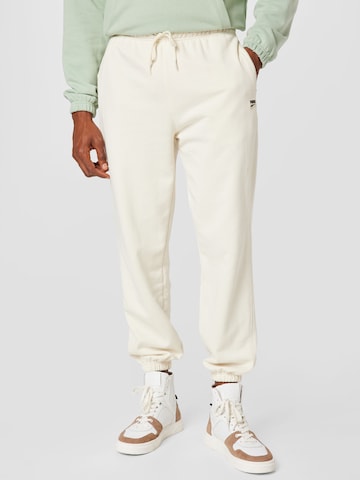 PUMA - Tapered Pantalón deportivo en beige