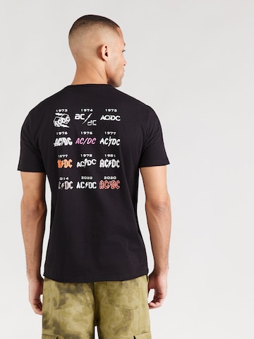 T-Shirt 'AC/DC - History Of A Tee' AMPLIFIED en noir : devant