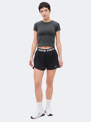 NIKE Loosefit Sporthose 'NP' in Schwarz