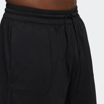 Regular Pantaloni sport 'Donovan Mitchell' de la ADIDAS SPORTSWEAR pe negru