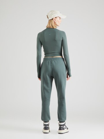 Effilé Pantalon de sport 'Phoenix Fleece' Nike Sportswear en vert