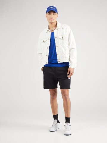 Maglietta di Champion Authentic Athletic Apparel in blu
