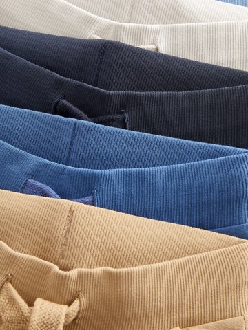Tapered Pantaloni di Next in colori misti
