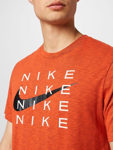 NIKE Funkcionalna majica | oranžna barva