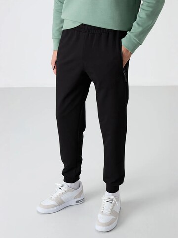 Tapered Pantaloni di Tommy Life in nero: frontale