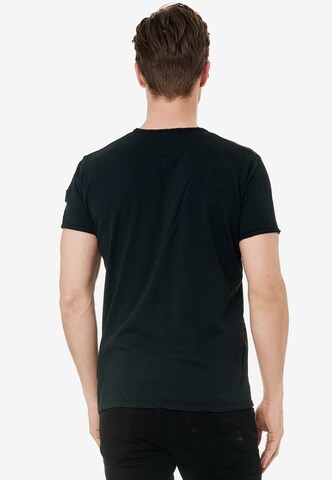 Rusty Neal T-Shirt mit Knopfleiste in Schwarz