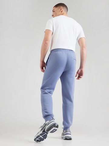 Nike Sportswear Tapered Byxa 'CLUB' i blå