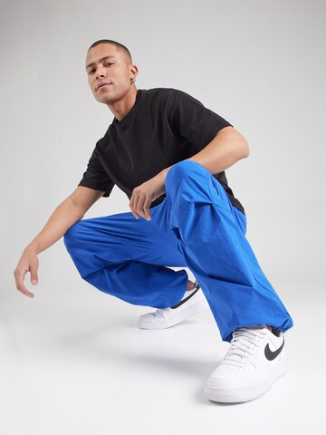 Nike Sportswear Tapered Nadrág 'Tech' - kék