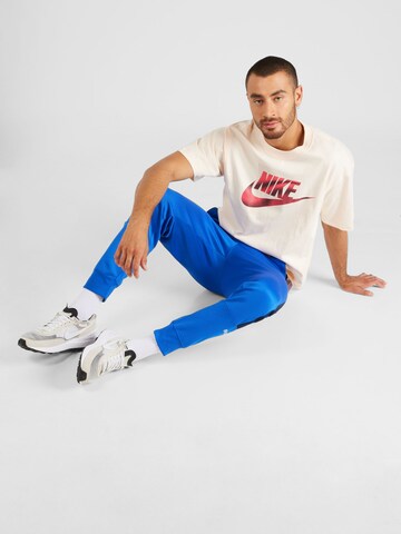 Regular Pantaloni sport 'AIR' de la Nike Sportswear pe albastru