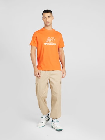 new balance T-shirt i orange