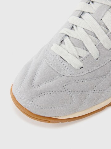 Baskets basses 'King' PUMA en gris