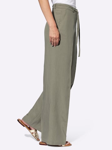 Wide leg Pantaloni con piega frontale di heine in verde