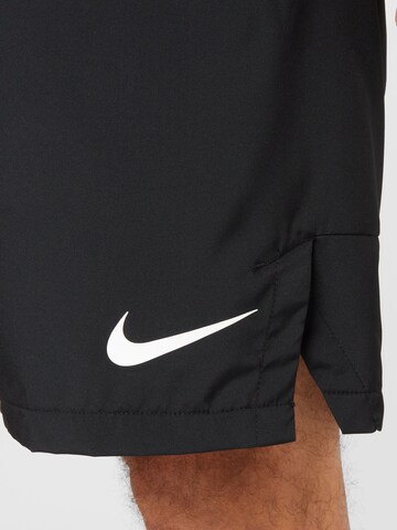 NIKE Regular Sports trousers in Black