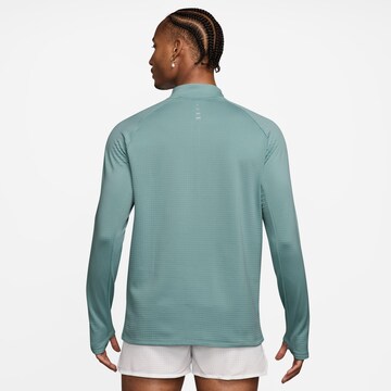 NIKE Performance Shirt 'WINTRZD STRIDE' in Blue