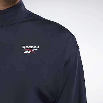 Reebok - Sudadera con cremallera deportiva en azul