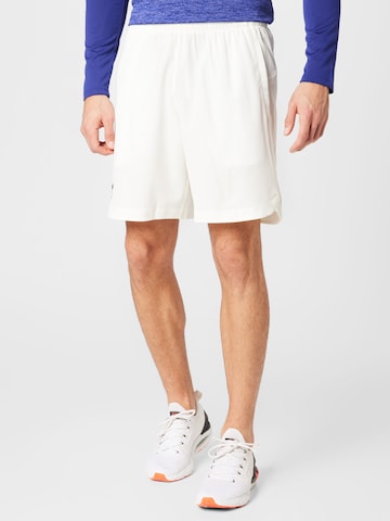 Regular Pantalon de sport UNDER ARMOUR en beige : devant