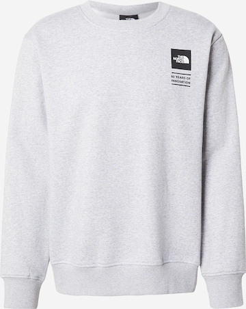 THE NORTH FACESweater majica 'CELEBRATION' - siva boja: prednji dio
