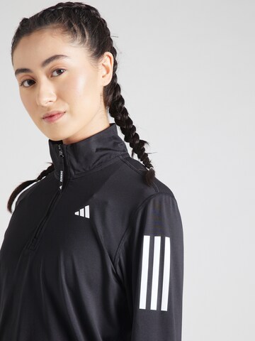 ADIDAS PERFORMANCE Sportsweatshirt 'Own The Run ' in Schwarz