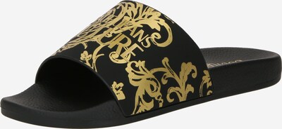 Versace Jeans Couture Natikače s potpeticom 'SHELLY' u zlatna / crna, Pregled proizvoda