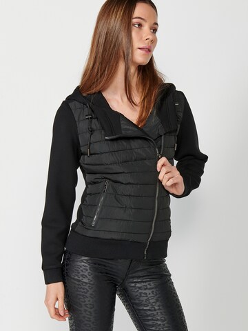 KOROSHI Välikausitakki värissä musta