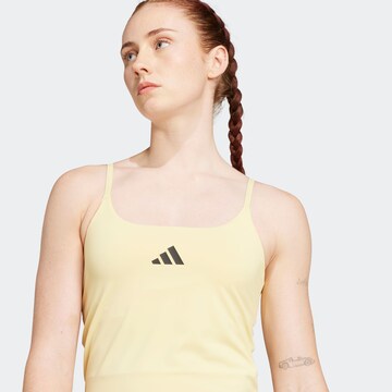 Top sportivo 'OPTIME' di ADIDAS PERFORMANCE in giallo