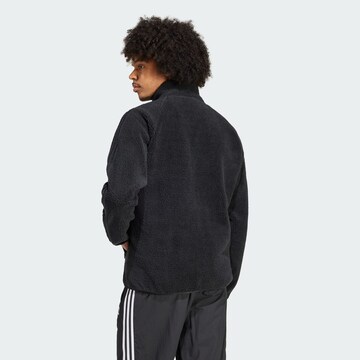 Jachetă  fleece de la ADIDAS ORIGINALS pe negru