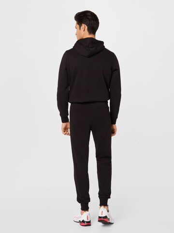 PUMA Tapered Sporthose in Schwarz