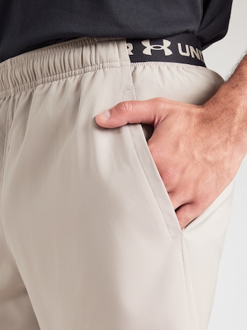 UNDER ARMOUR - Regular Calças de desporto em cinzento