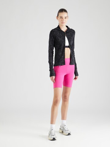 UNDER ARMOUR Skinny Sports trousers 'Motion' in Pink