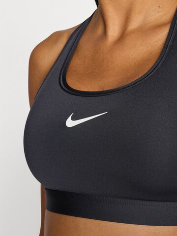 NIKE Bustier Biustonosz sportowy 'SWSH' w kolorze czarny