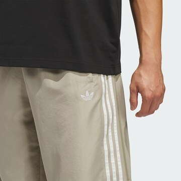 ADIDAS ORIGINALS Loose fit Trousers in Brown