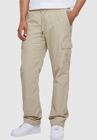 Urban Classics Loose fit Cargo Pants in Beige: front