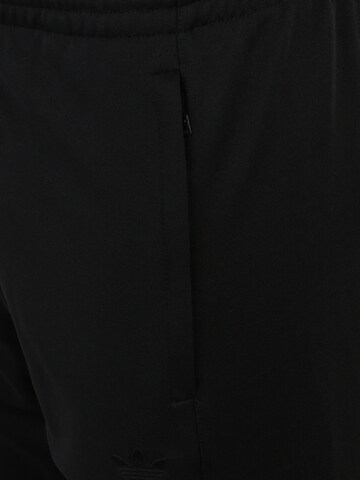 Effilé Pantalon de sport 'Rekive' ADIDAS ORIGINALS en noir