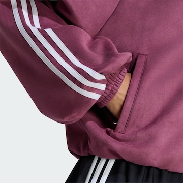 ADIDAS ORIGINALS Välikausitakki 'Adilenium Season 6' värissä punainen